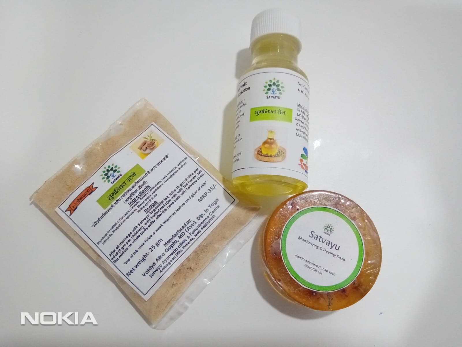 Satvayu ubtan, sugandhit oil and moisturizing soap with product labels